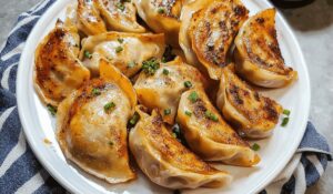 Sheet Pan Spicy Chicken Potstickers With Ginger Sauce Recipe