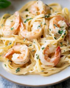 Fettuccine Tossed in Luscious Garlic Cream Sauce with Juicy Prawns Recipe