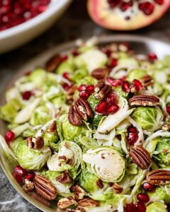 Irresistible Shaved Brussels Sprouts Salad with Pomegranate and Candied Pecans Recipe